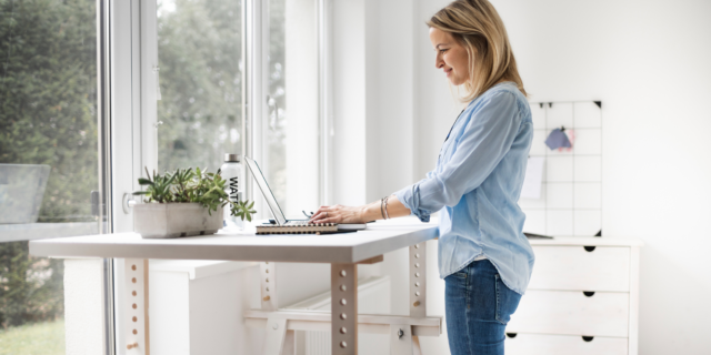 Woman at standing desk on laptop